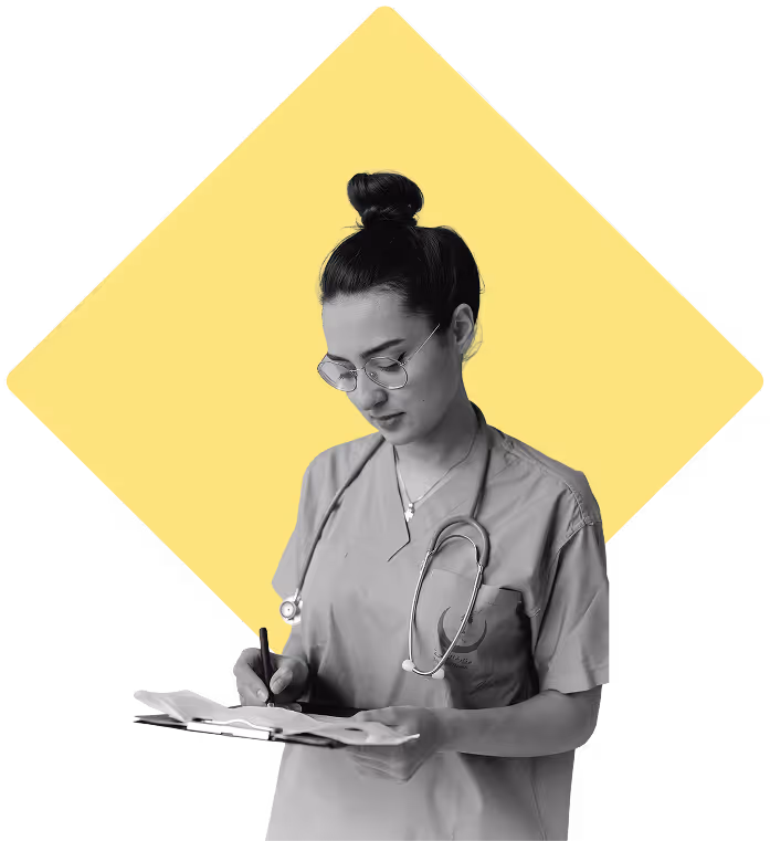 Nurse writing things down while standing